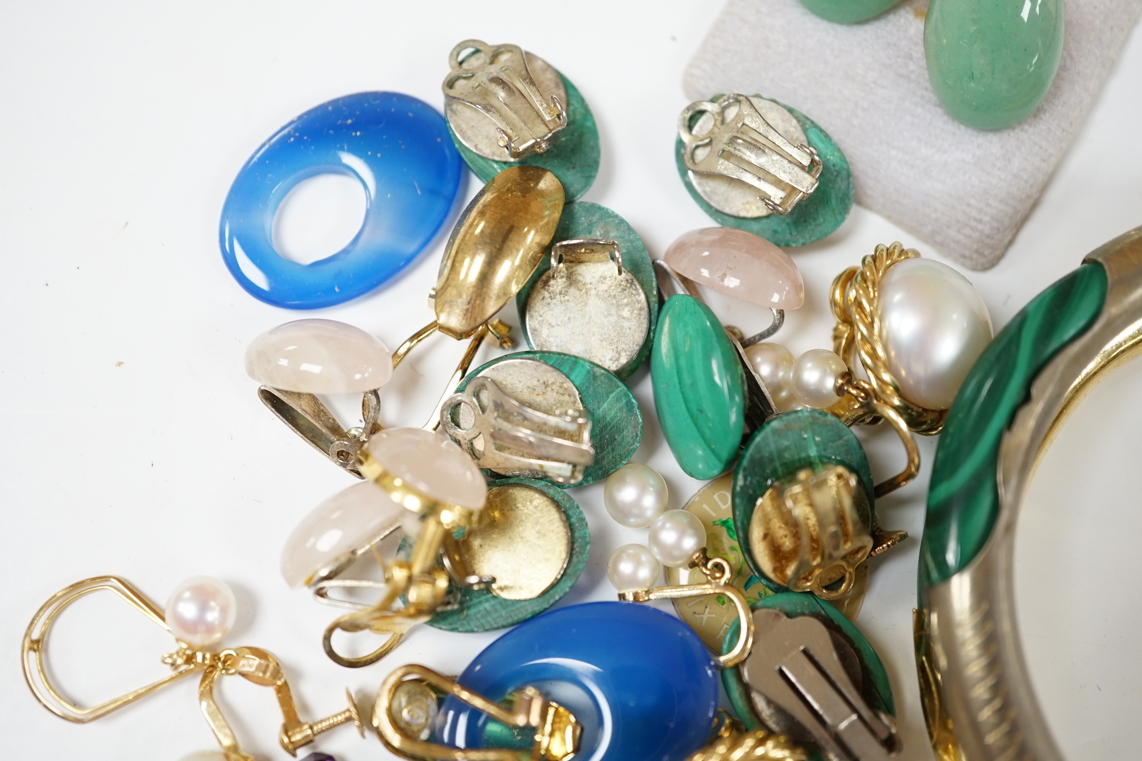 A pair of 14k and three stone cultured pearl set drop ear clips, 23mm, a pair of 18k and single stone cultured pearl set ear clips, a quantity of assorted costume ear clips and two bangles etc.